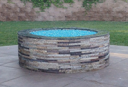 Bahama Blue Reflective installed in a fire pit with repurposed granite pavers